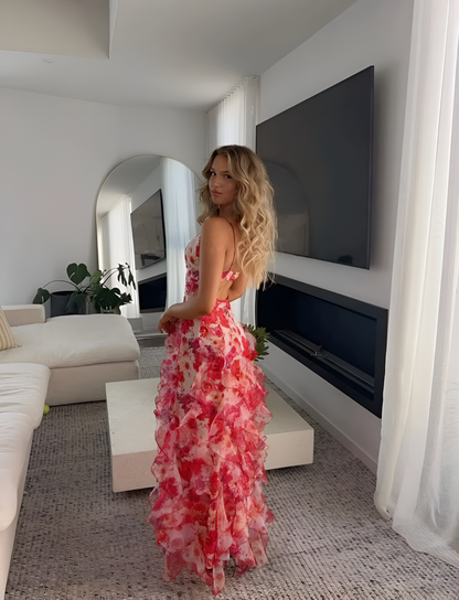 Side and rear angle of the Quinta red ruffle floral maxi dress on model