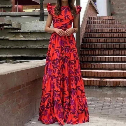 Netta red ruffle sleeve floral maxi dress, front view on a city street