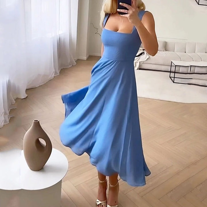 Georgiana women's satin cocktail midi dress in blue, front view on model twirling
