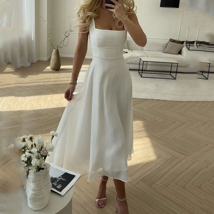 Georgiana women's satin cocktail midi dress in white, front view on model indoors