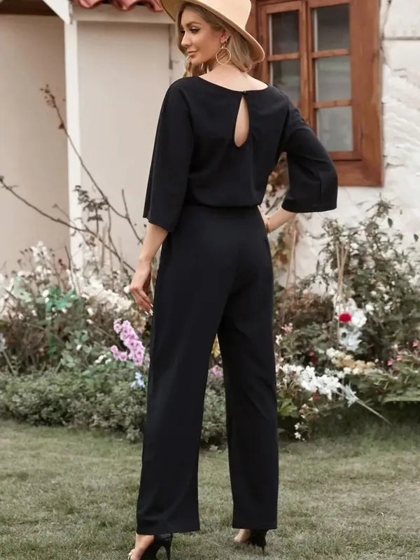 Black Harlene women's scuba knit casual jumpsuit, back view with keyhole detail
