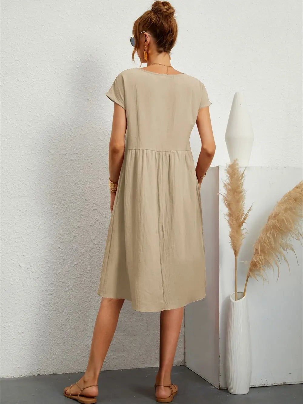 Henrietta women's shift summer midi dress in khaki, back view on model