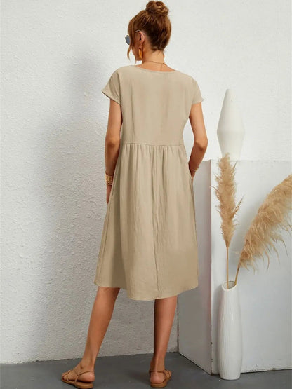 Henrietta women's shift summer midi dress in khaki, back view on model