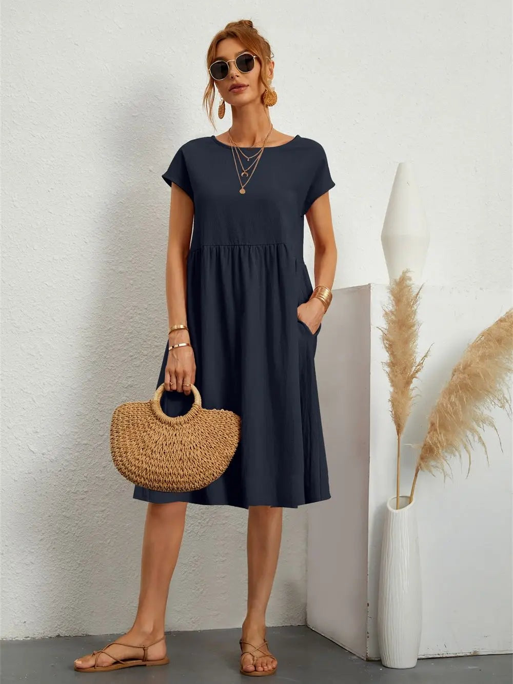 Henrietta women's shift summer midi dress in navy blue, second front view on model