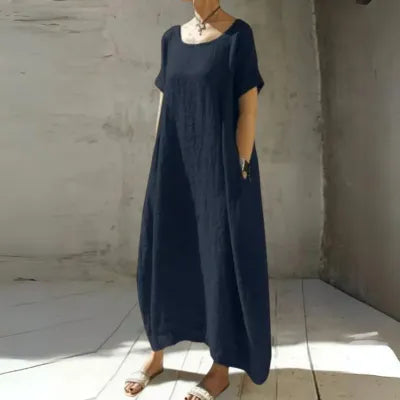 Gilda short sleeve caftan maxi dress in navy blue, front view on model