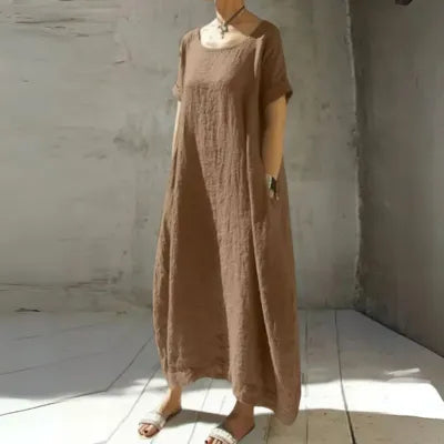 Gilda caftan maxi dress in brown, relaxed front view with side pockets