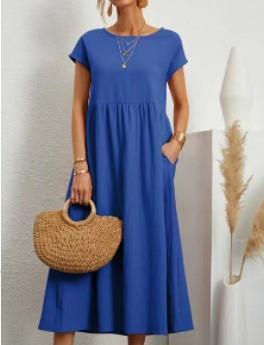 Esmeralda women's short sleeve midi dress in blue, front view with straw bag