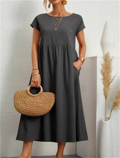 Esmeralda women's short sleeve midi dress in gray, front view with straw bag