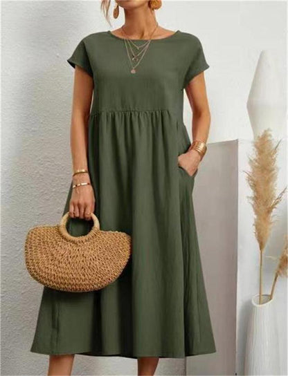 Esmeralda women's short sleeve midi dress in olive green, front view with straw bag
