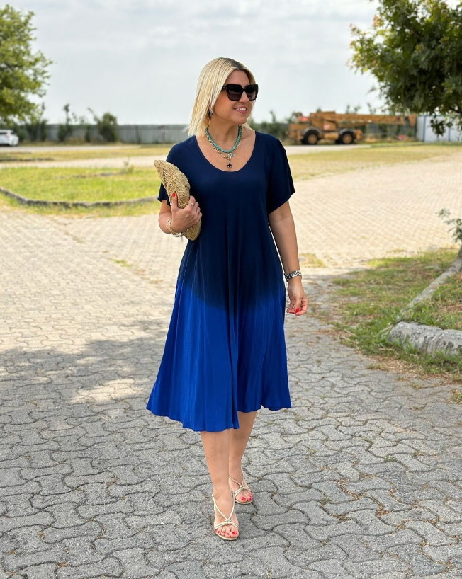 Elonia women's short sleeve midi dress in blue ombre, front view on model outdoors
