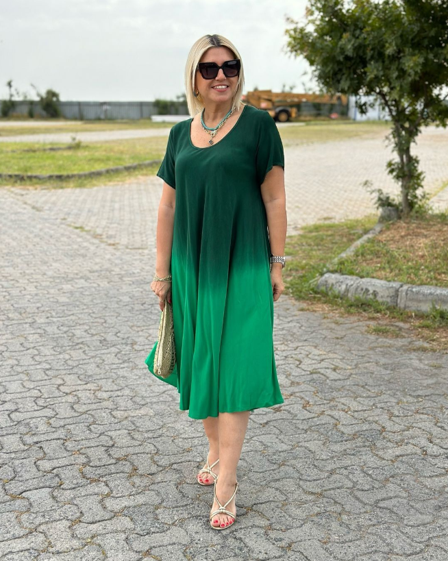 Elonia women's short sleeve midi dress in green ombre, front view on model outdoors