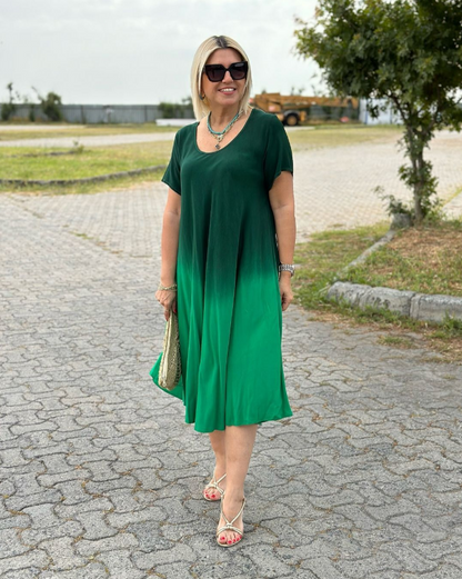 Elonia women's short sleeve midi dress in green ombre, front view on model outdoors