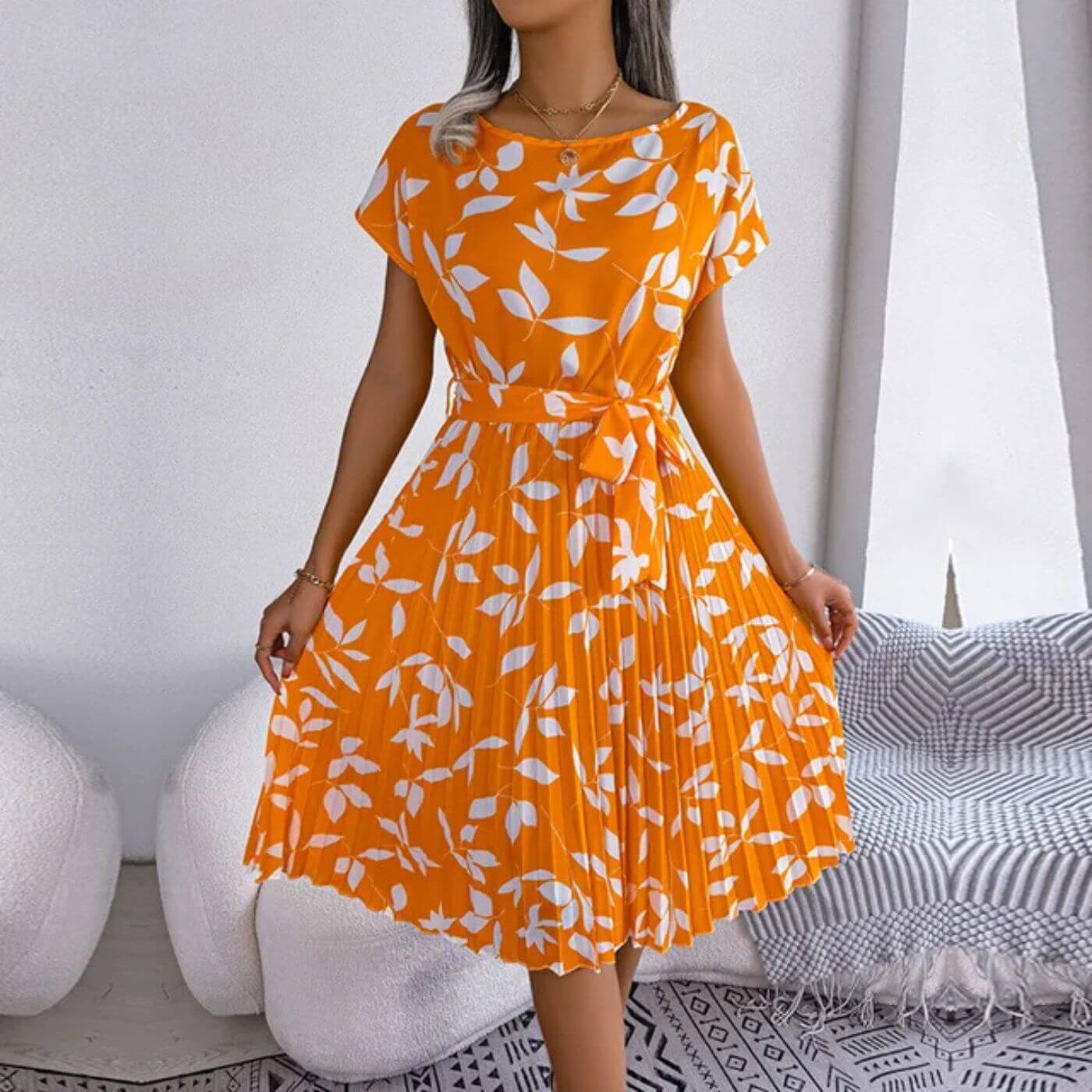 Jacinta women's short sleeve midi dress in orange leaf print, front view on model