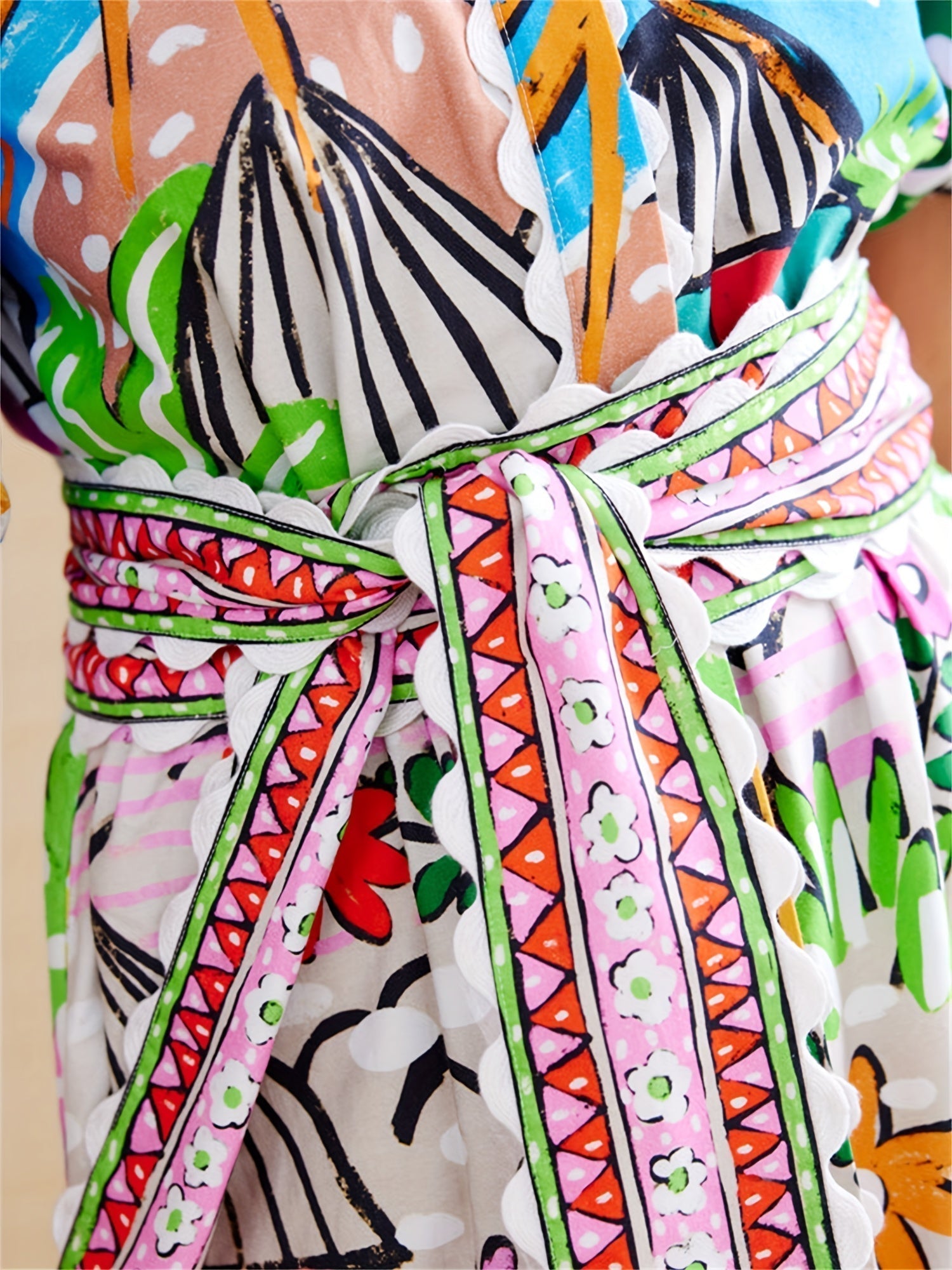 Detail of the knotted printed belt on the Marjolaine shirt maxi dress