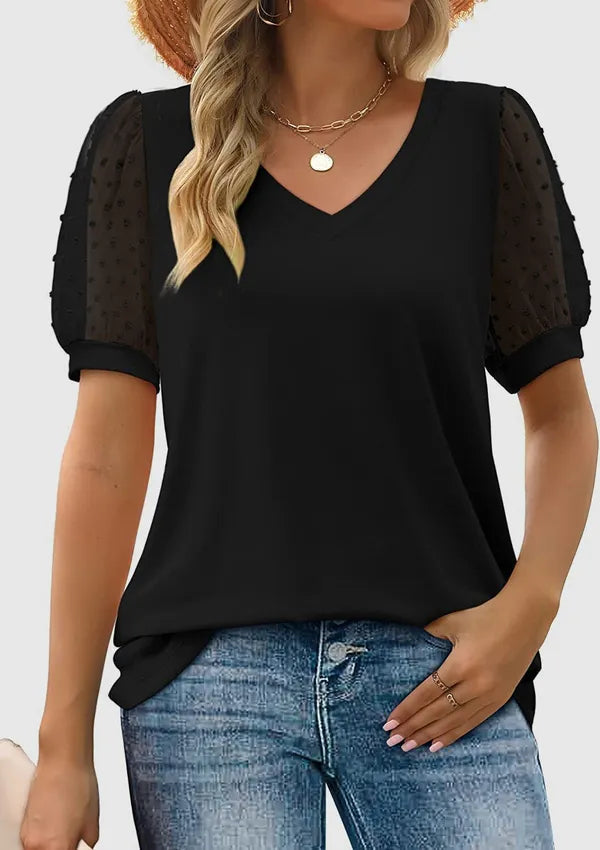 Nerissa women's short sleeve V-neck blouse in black, front view on model with jeans