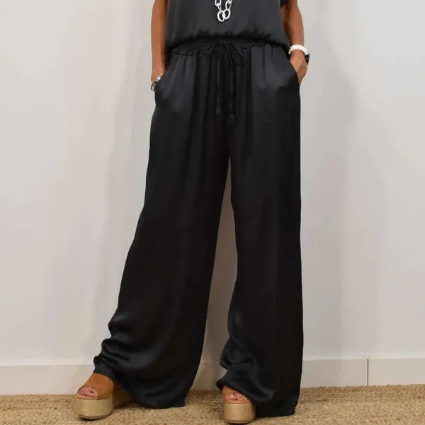 Anamaria black satin set, close-up of drawstring waist and wide leg trousers