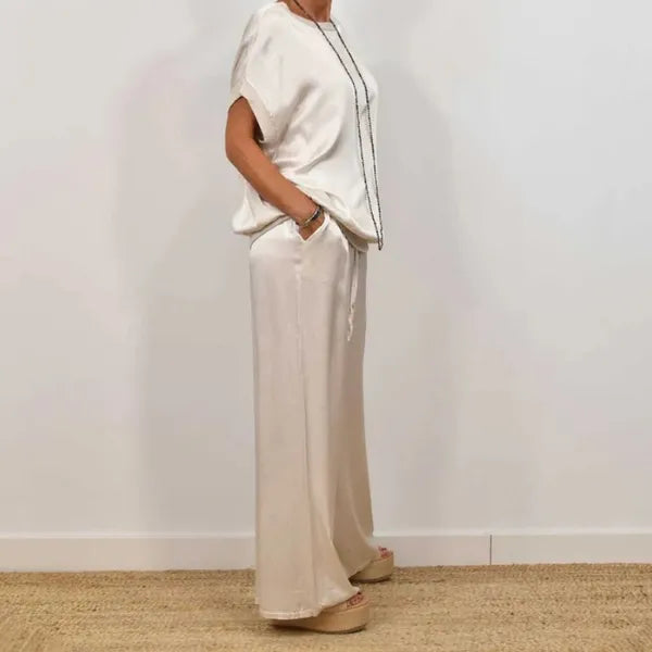 Anamaria white satin top and wide leg trousers set, side profile on model