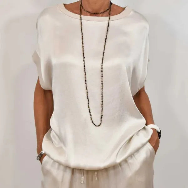 Anamaria white satin set, close-up of the round neck short sleeve top