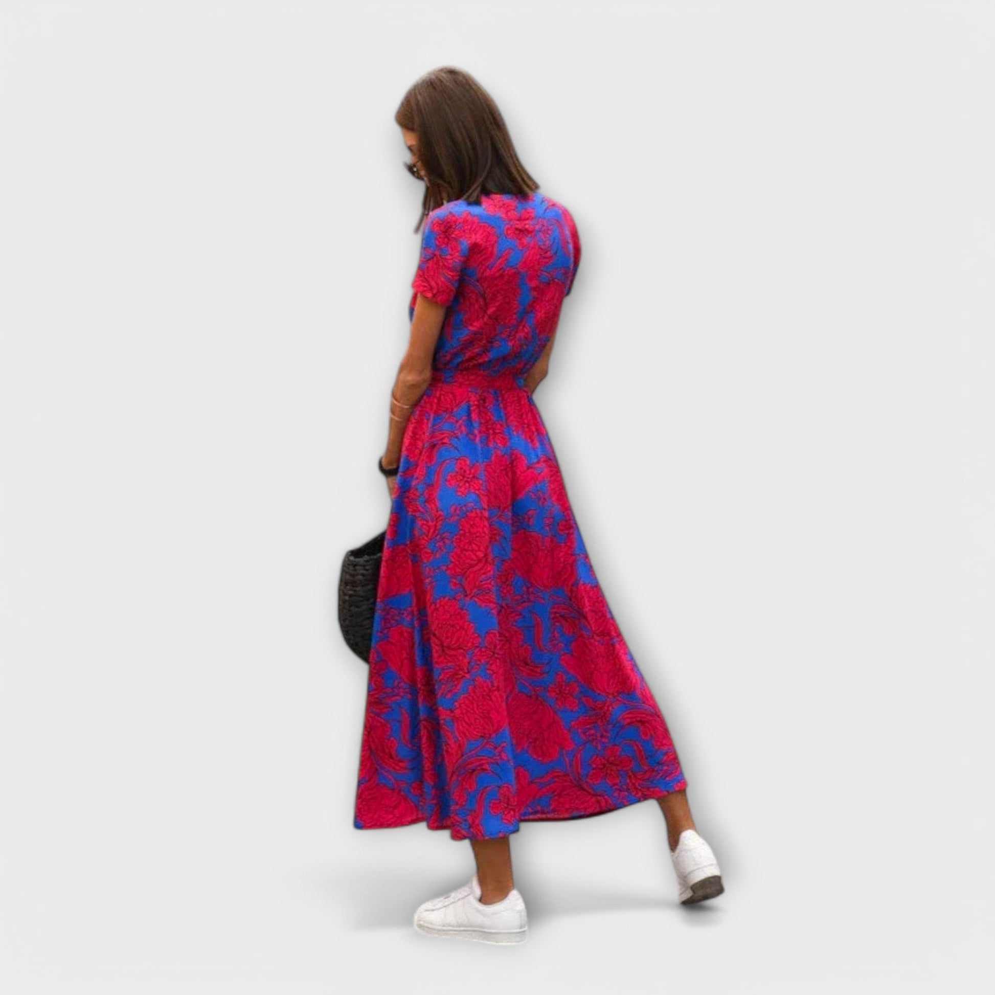 Mariz women's pleated midi dress in red and blue print, back view on model
