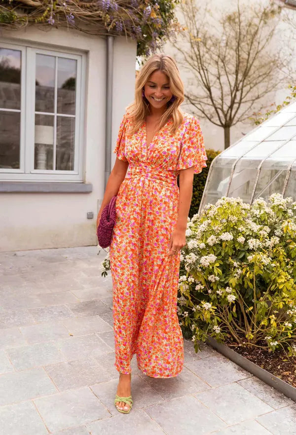 Front view of the Lotte orange floral maxi dress with smocked waist
