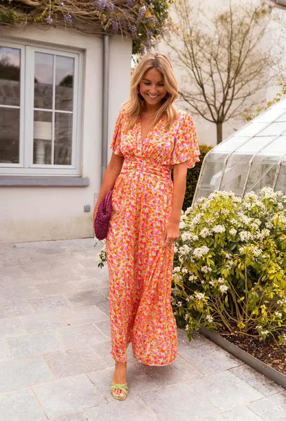 Front view of the Lotte orange floral maxi dress with smocked waist