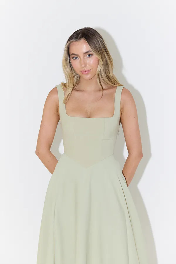 Close-up of the sage green Edmee A-line maxi dress bodice and straps