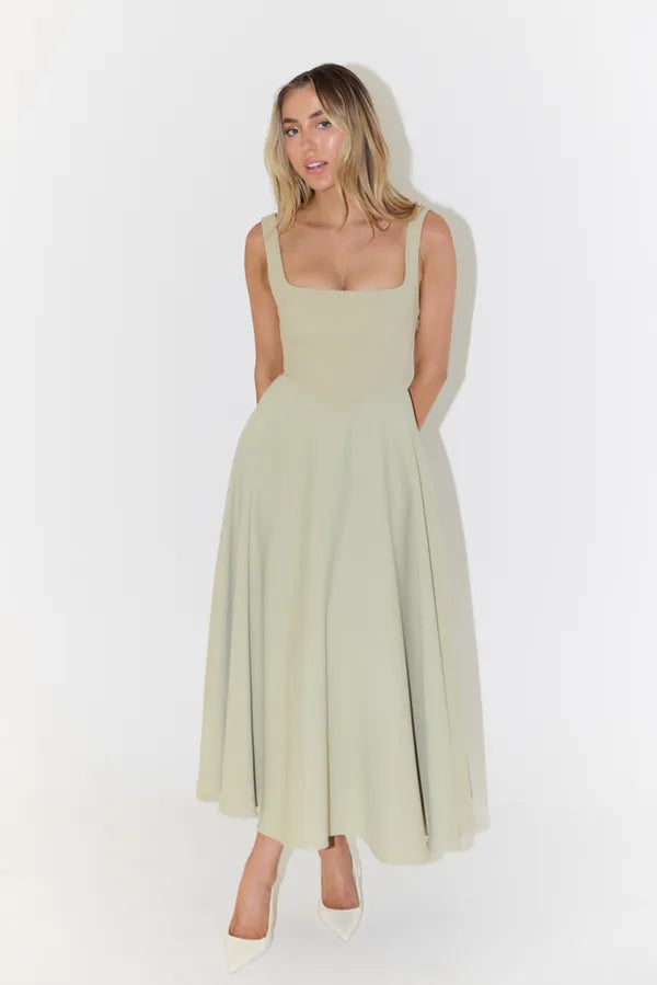 Edmee sleeveless A-line maxi dress in sage green, front view on model