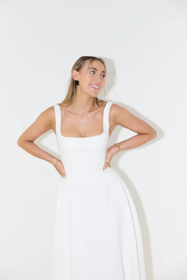 Close-up of the square neckline on the white Edmee A-line maxi dress