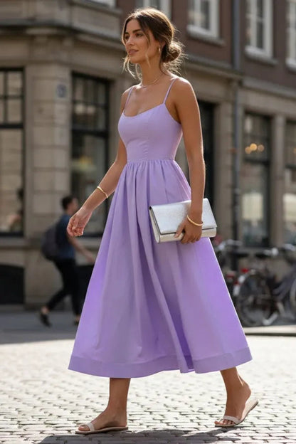 Mandy women's sleeveless cocktail midi dress in lilac purple, walking side view