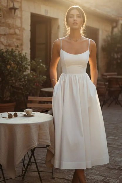 Mandy women's sleeveless cocktail midi dress in white, front view on model outdoors