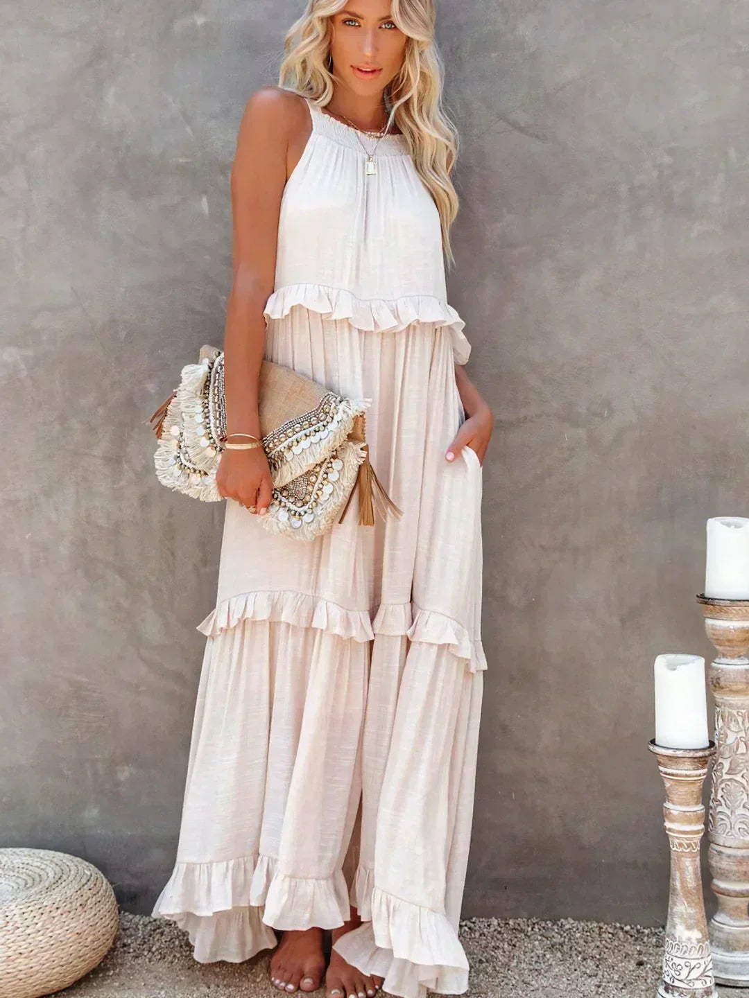 Beige Kiersten sleeveless maxi dress full length front view with clutch bag