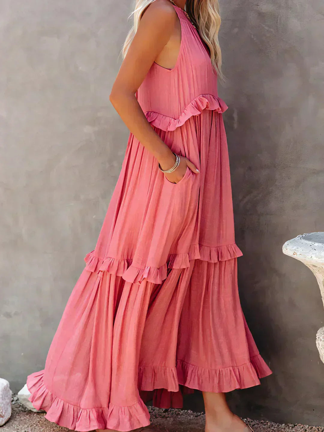 Side view of the pink Kiersten maxi dress showing the volume of the tiered skirt