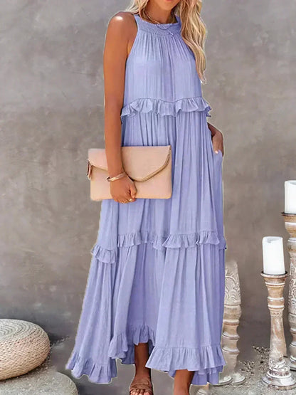 Kiersten women's sleeveless maxi dress in purple, front view with a nude clutch