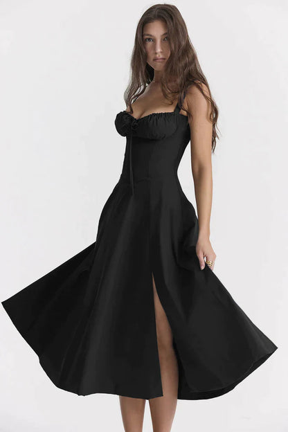 Ebba women's sleeveless summer midi dress in black, front view with skirt in motion