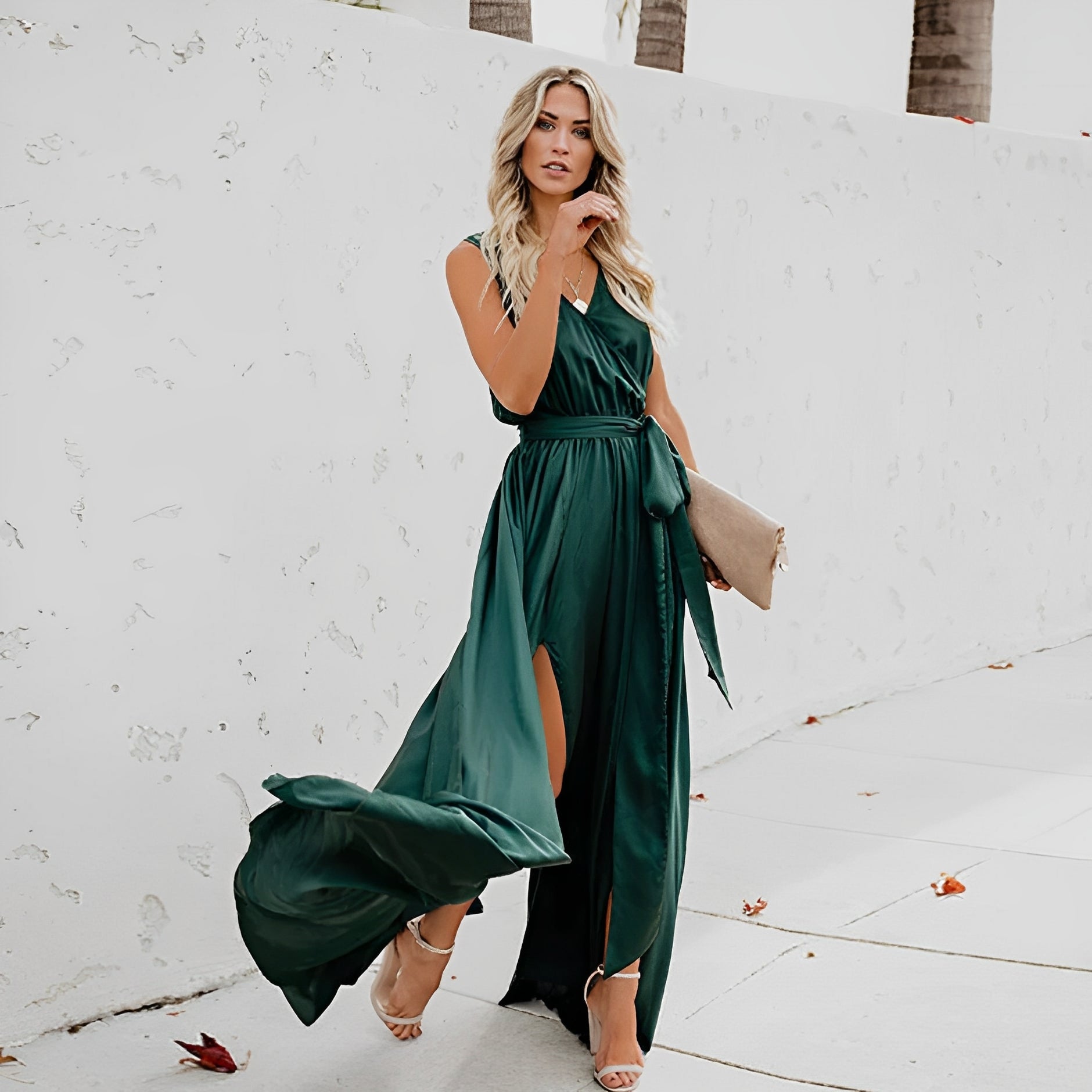 Chloe sleeveless wrap maxi dress in emerald green, front view showing the tie waist