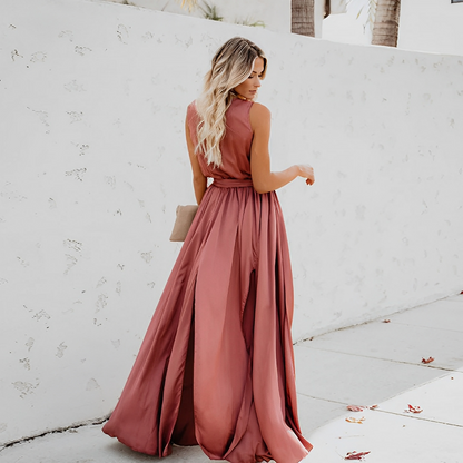 Back view of the pink Chloe sleeveless wrap maxi dress with flowing skirt