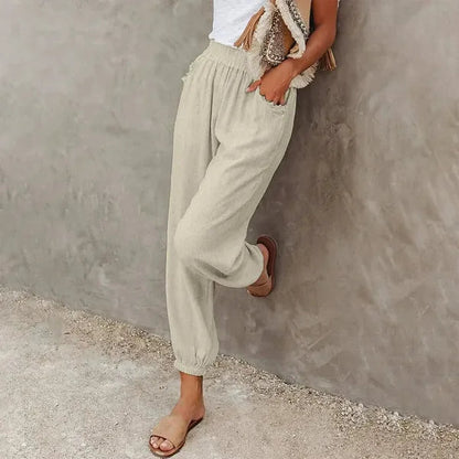 Agnes Women's Smocked Waist Harem Trousers in beige, front view on model