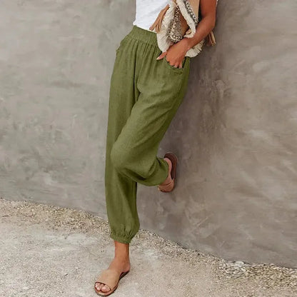 Agnes Women's Smocked Waist Harem Trousers in olive green, front view on model