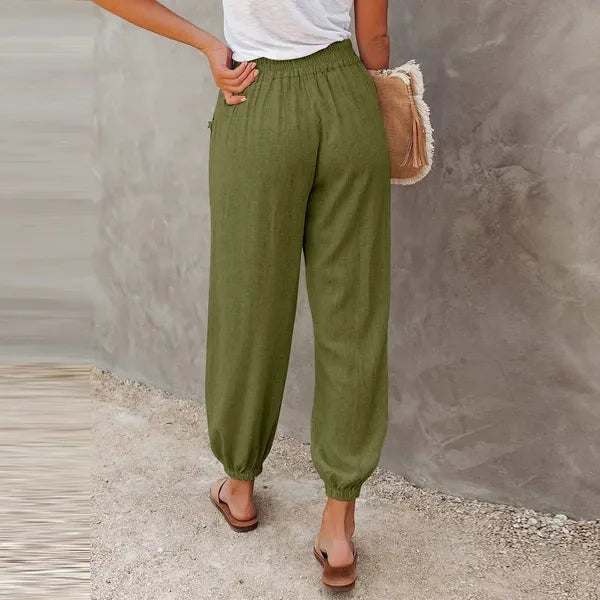 Agnes Women's Smocked Waist Harem Trousers in olive green, back view on model