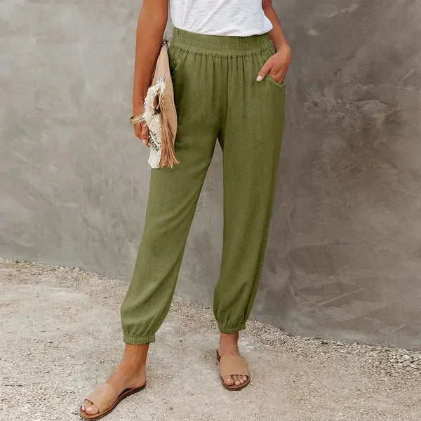 Agnes Women's Smocked Waist Harem Trousers in olive green, front view of tapered cuff