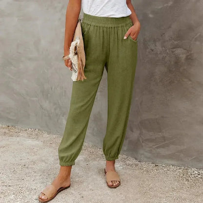 Agnes Women's Smocked Waist Harem Trousers in olive green, front view of tapered cuff