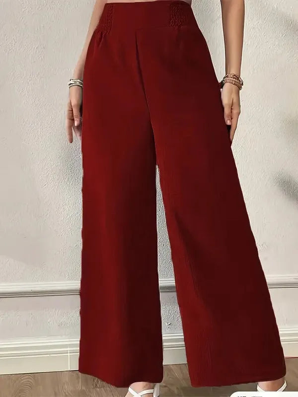 Elsie Women's Smocked Waist Wide Leg Pants in burgundy, front view on model