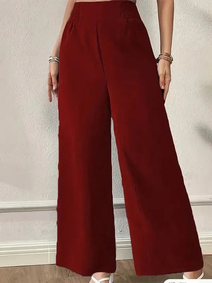 Elsie Women's Smocked Waist Wide Leg Pants in burgundy, front view on model