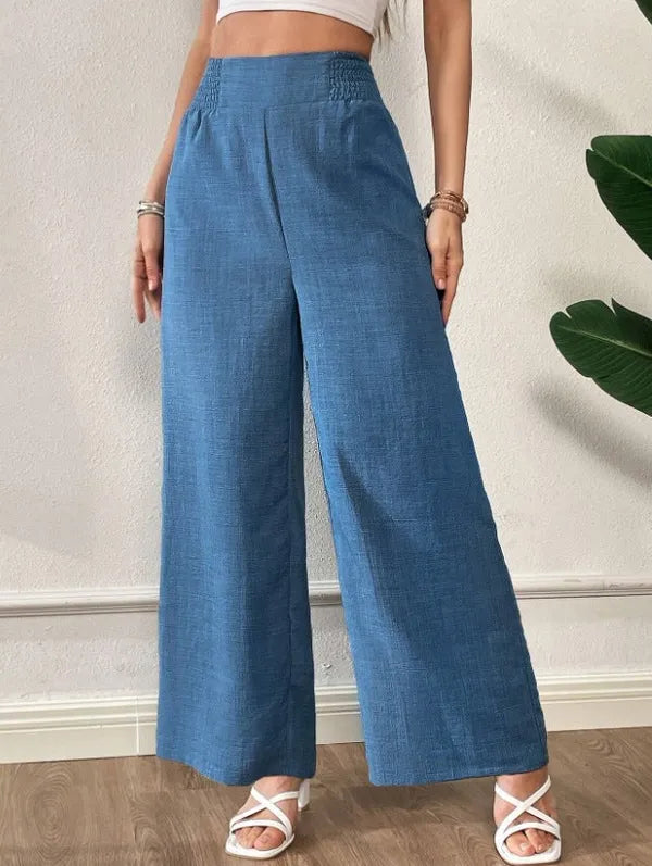 Elsie Women's Smocked Waist Wide Leg Pants in denim blue, front view on model
