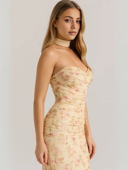 Yellow floral Anya maxi dress seen at an angle showing the ruched mesh bodice