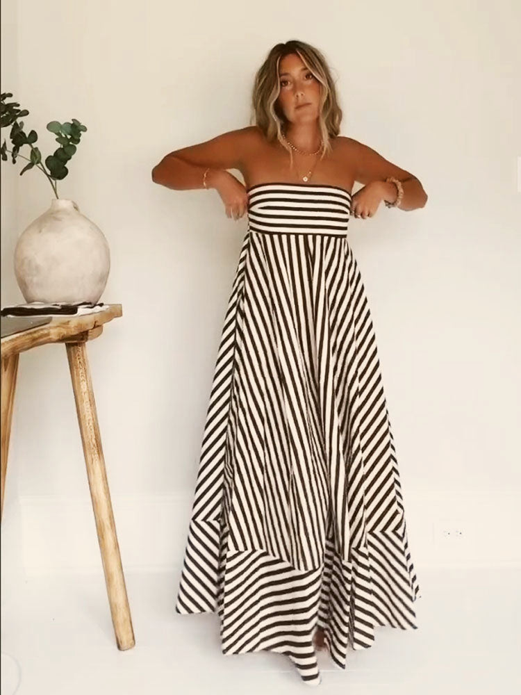 Striped Orsolya strapless maxi dress worn indoors, front view of the flared skirt