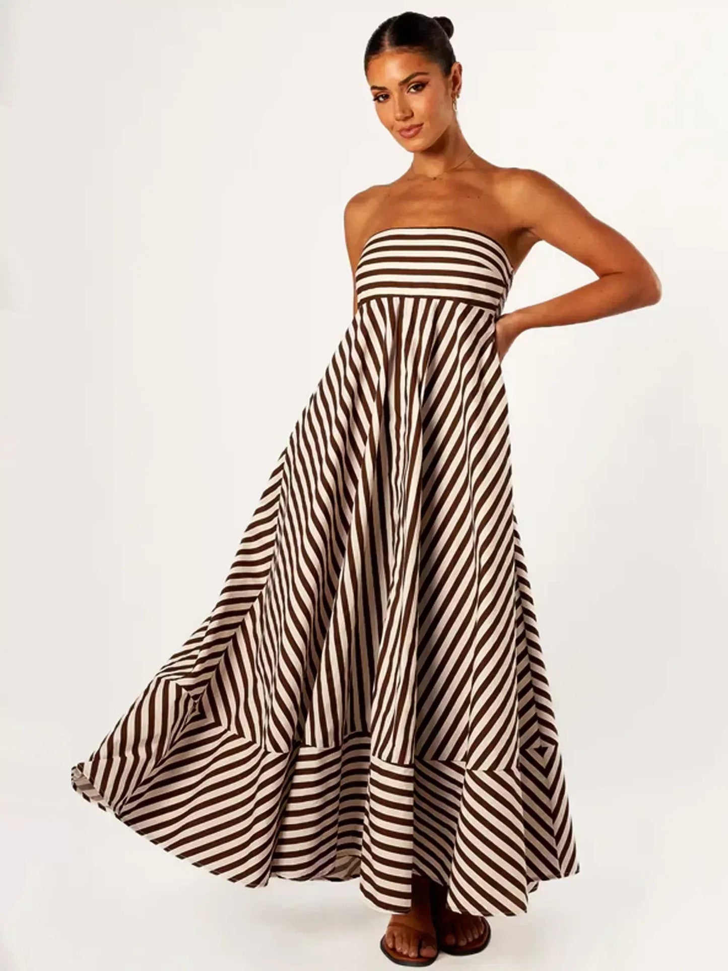 Full length front view of the Orsolya strapless striped maxi dress on model