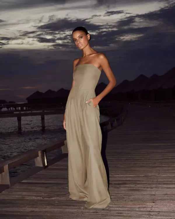 Khaki Shadi women's strapless wide-leg cocktail jumpsuit on a model at dusk