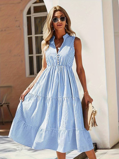 Violeta women's striped flowy summer midi dress in blue stripes, front view on model