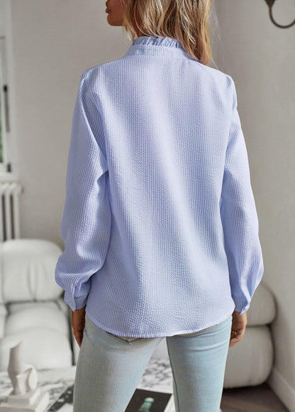 Blue Elettra women's striped ruffle long sleeve blouse seen from the back